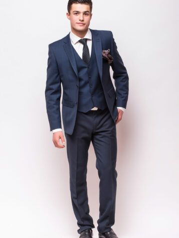 Full body portrait of a businessman in suit standing on white background