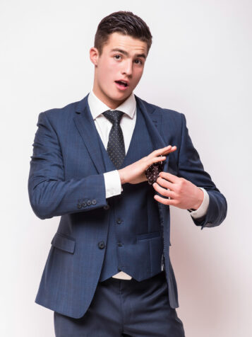 Portrait of happy smiling young businessman, isolated on white background. Business success concept.