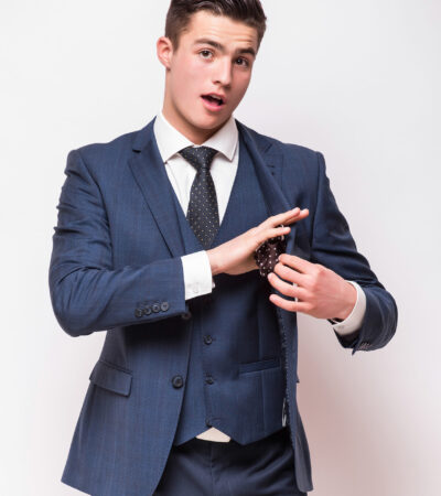 Portrait of happy smiling young businessman, isolated on white background. Business success concept.